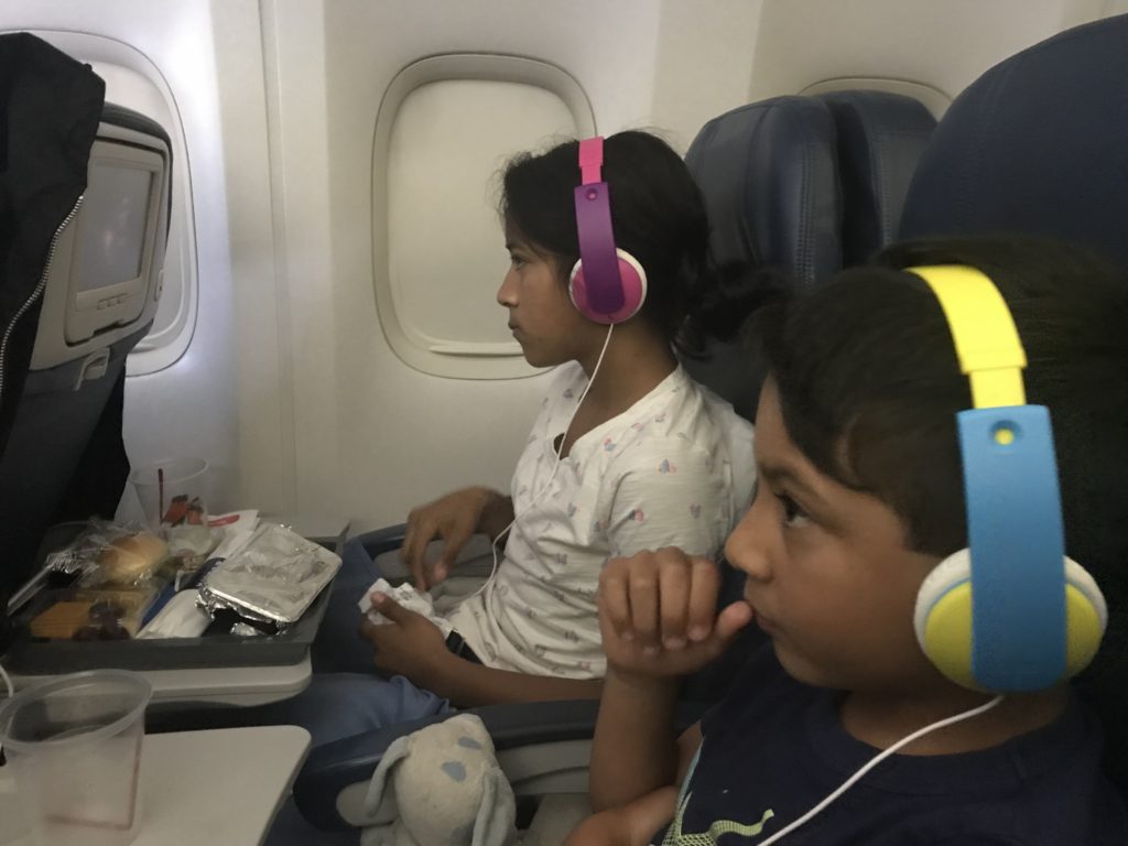 a girl and boy wearing headphones