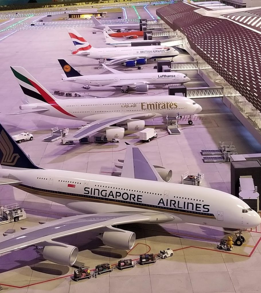 a group of airplanes in an airport