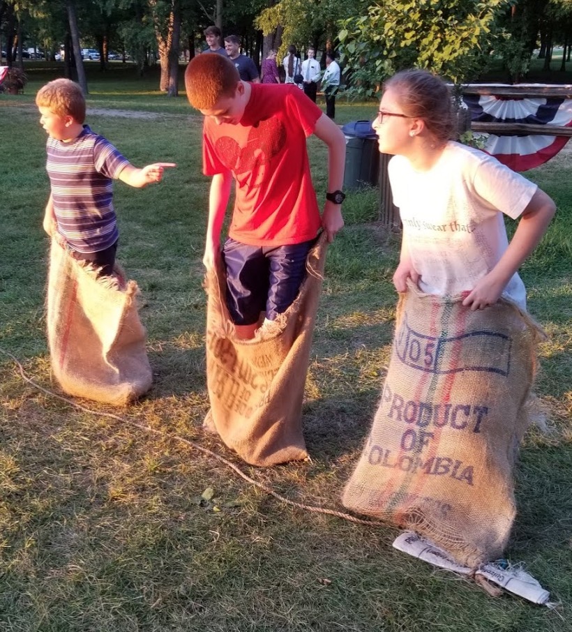 a group of kids in sacks