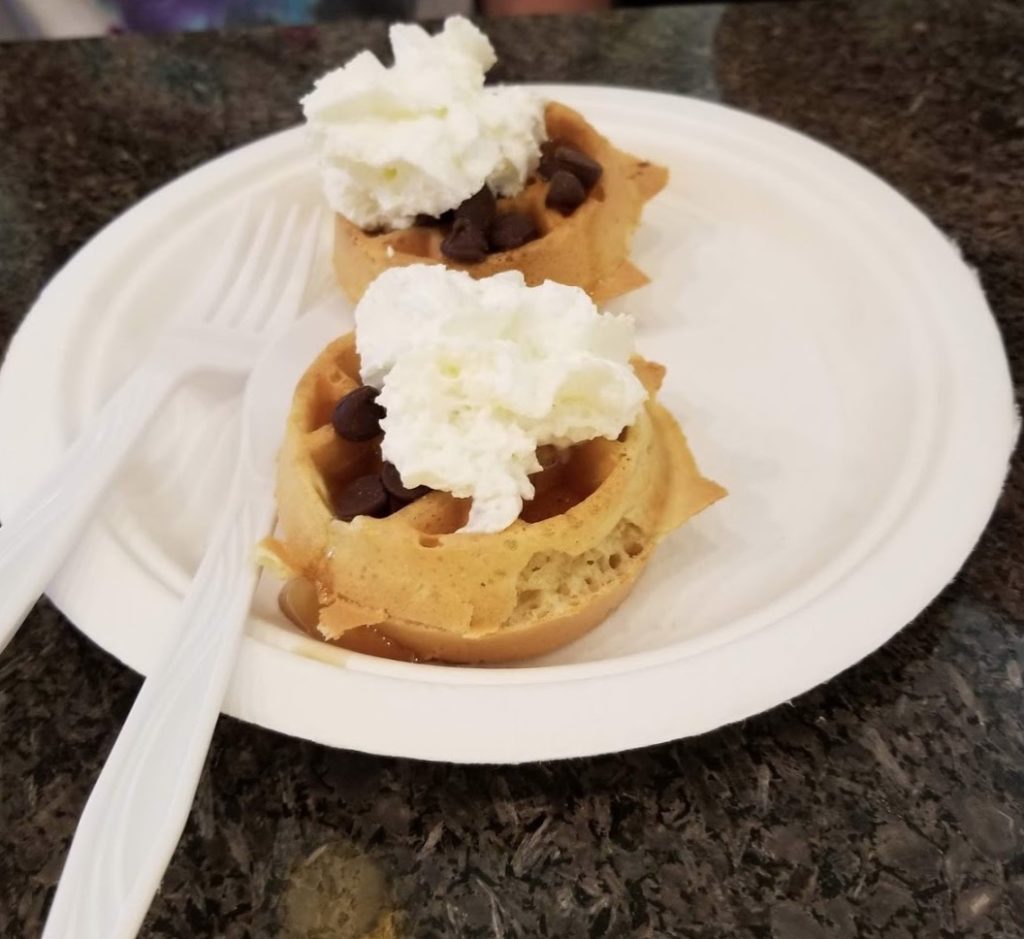 waffles with whipped cream and chocolate chips on a plate