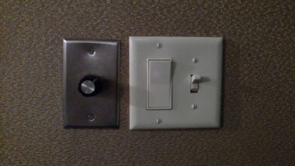 a light switch and a switch on a wall