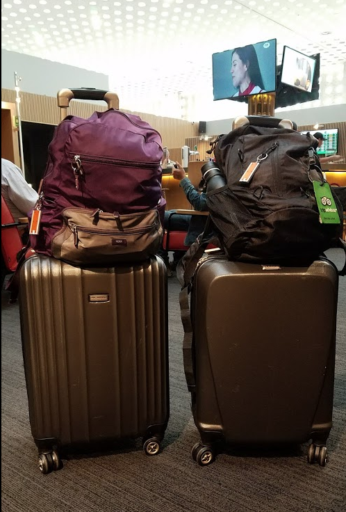 a couple of luggage on top of each other