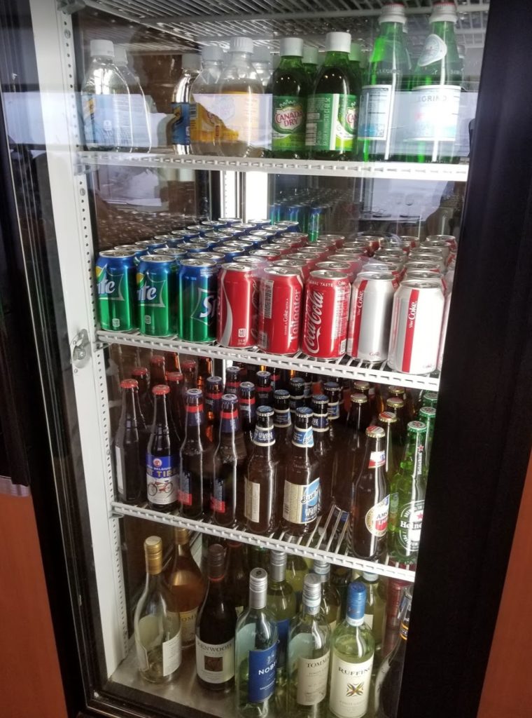 a refrigerator full of cans and bottles