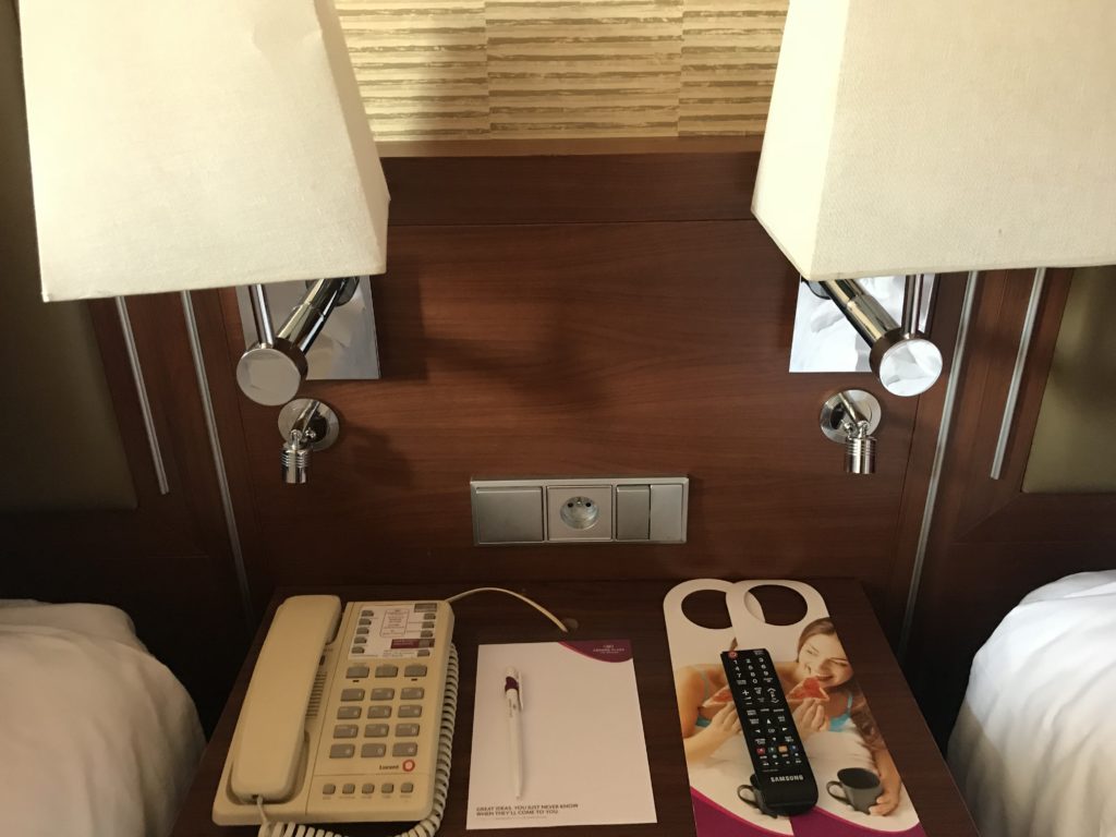 a telephone and papers on a table