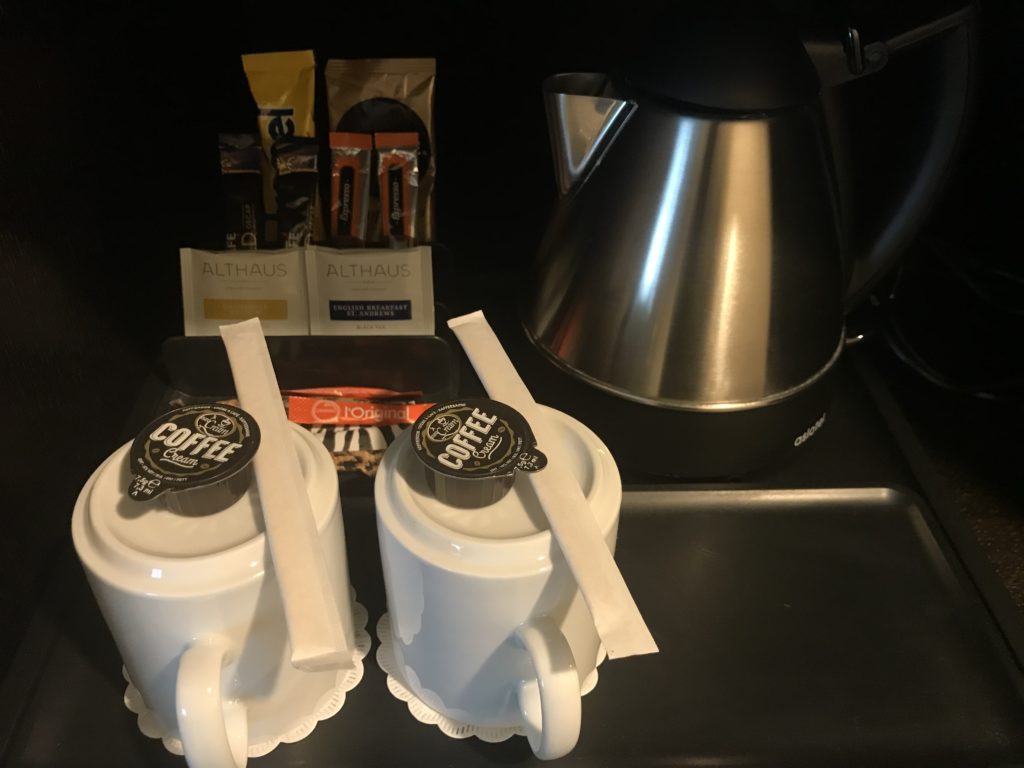 a coffee pot and coffee cups