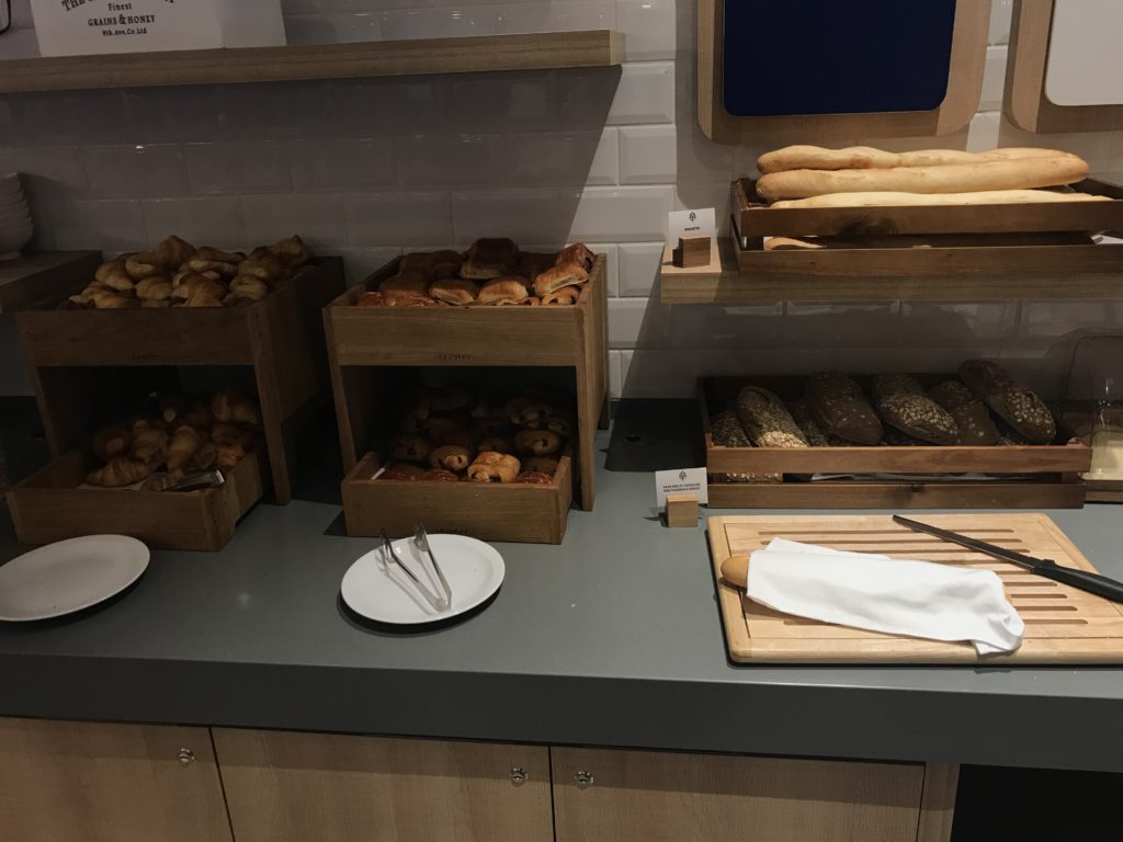 a counter with bread in boxes