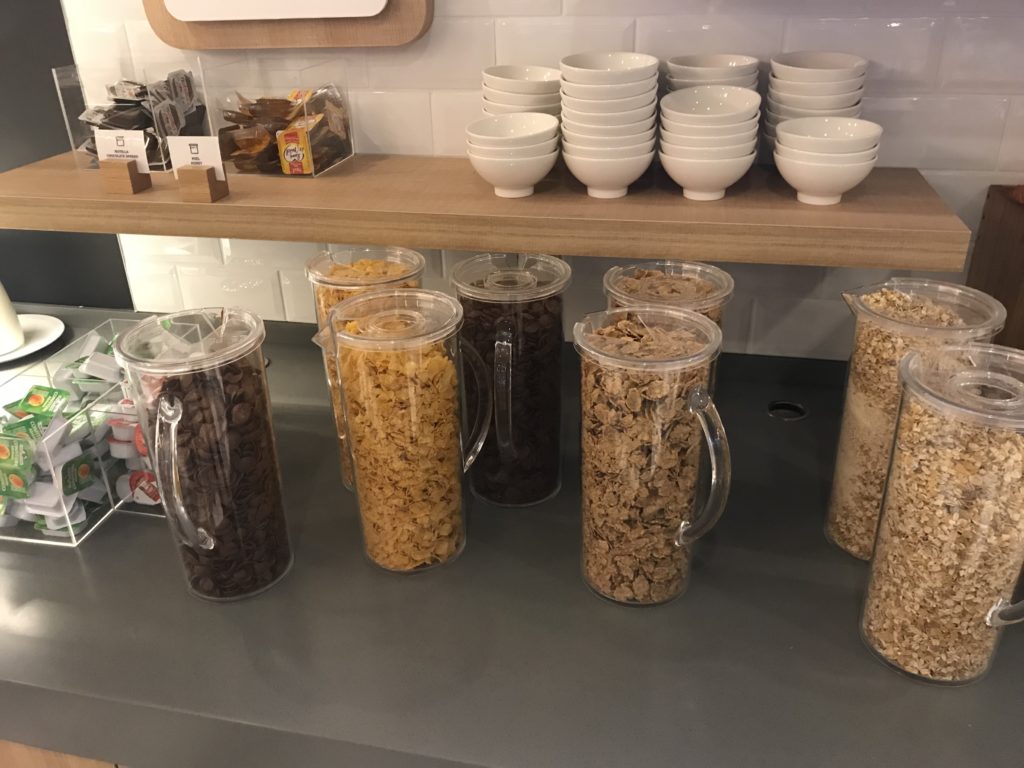 cereal and coffee in containers on a shelf