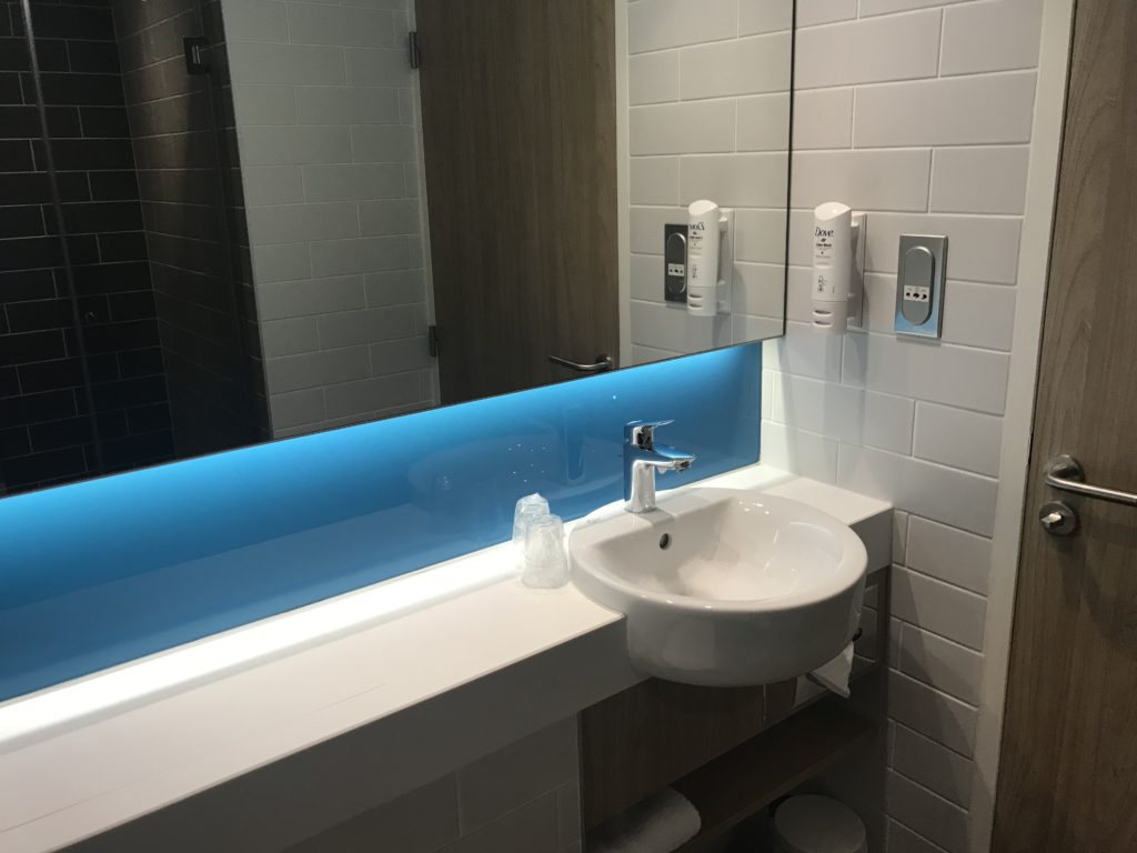 a bathroom with a blue light