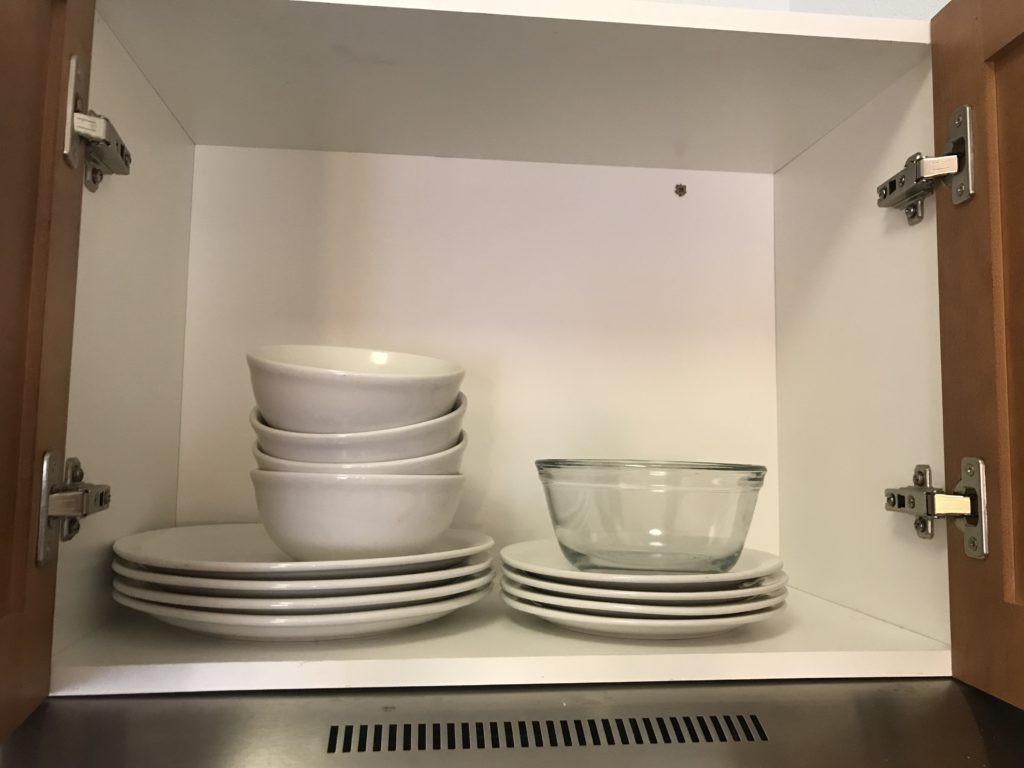 a shelf with plates and bowls