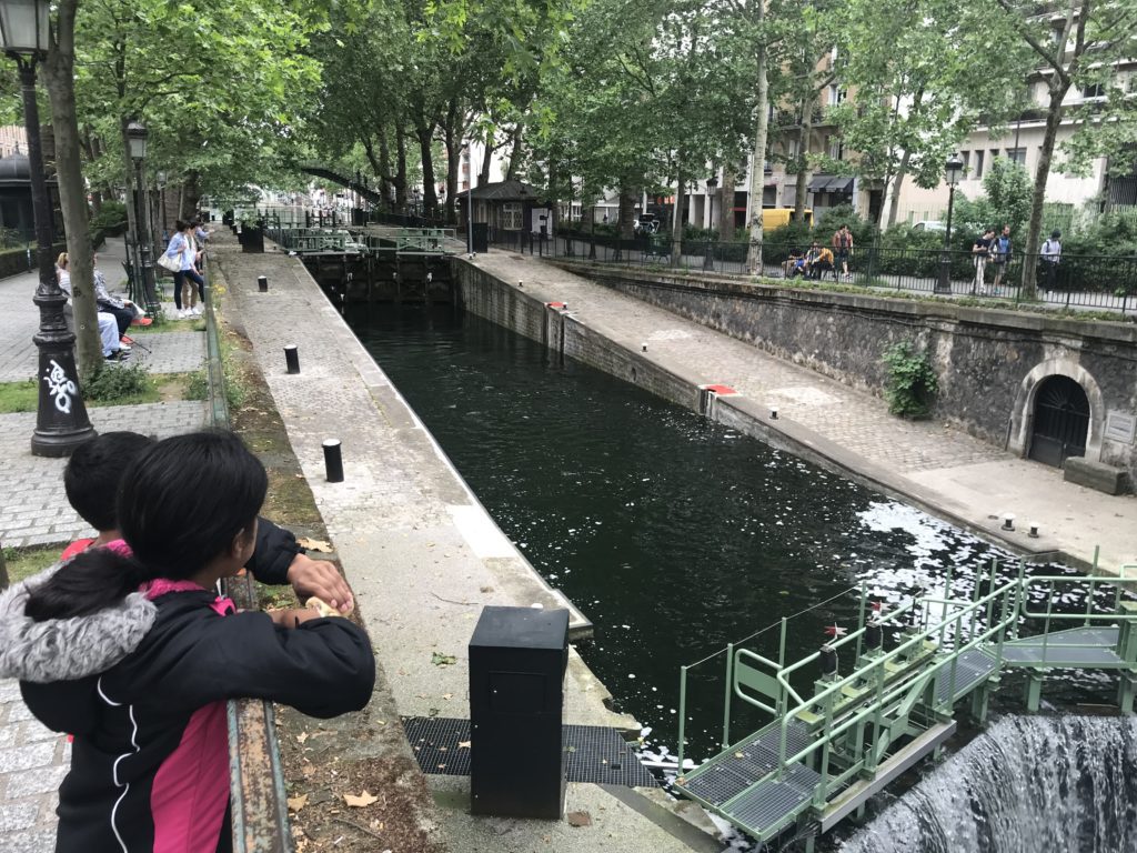 a person looking at a canal