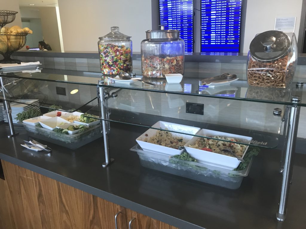 food in a buffet with a screen