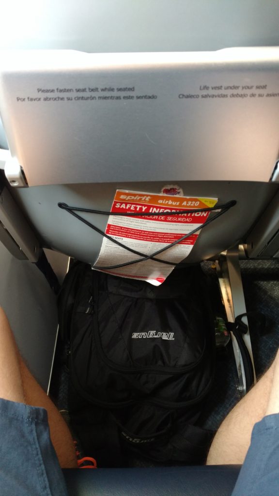 a black backpack on a plane