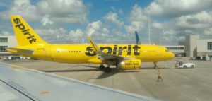 a yellow airplane on the runway