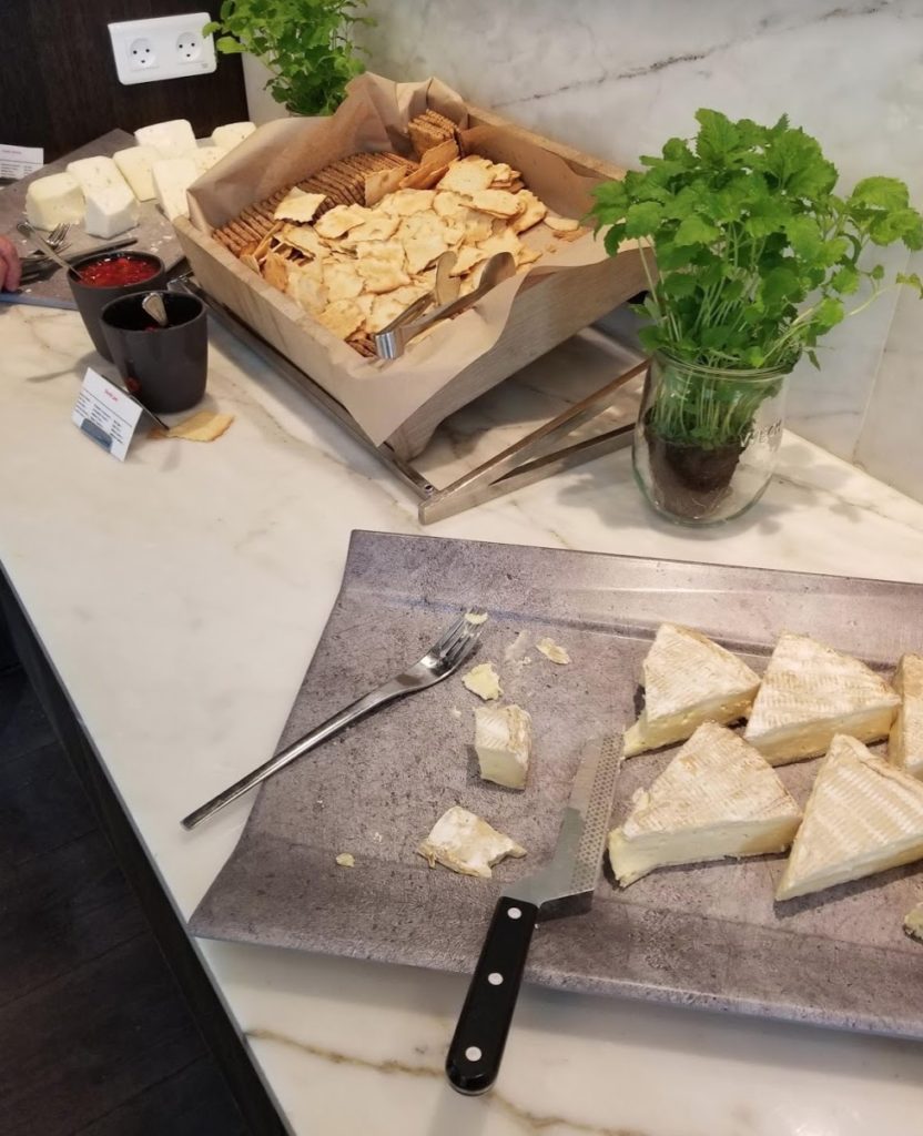 a tray of cheese and crackers on a counter