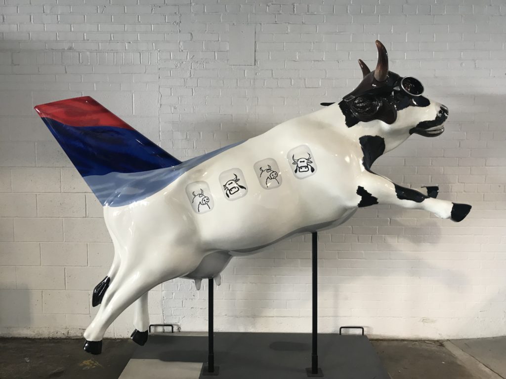 a cow statue with wings