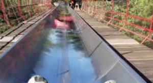 a water slide going down a bridge