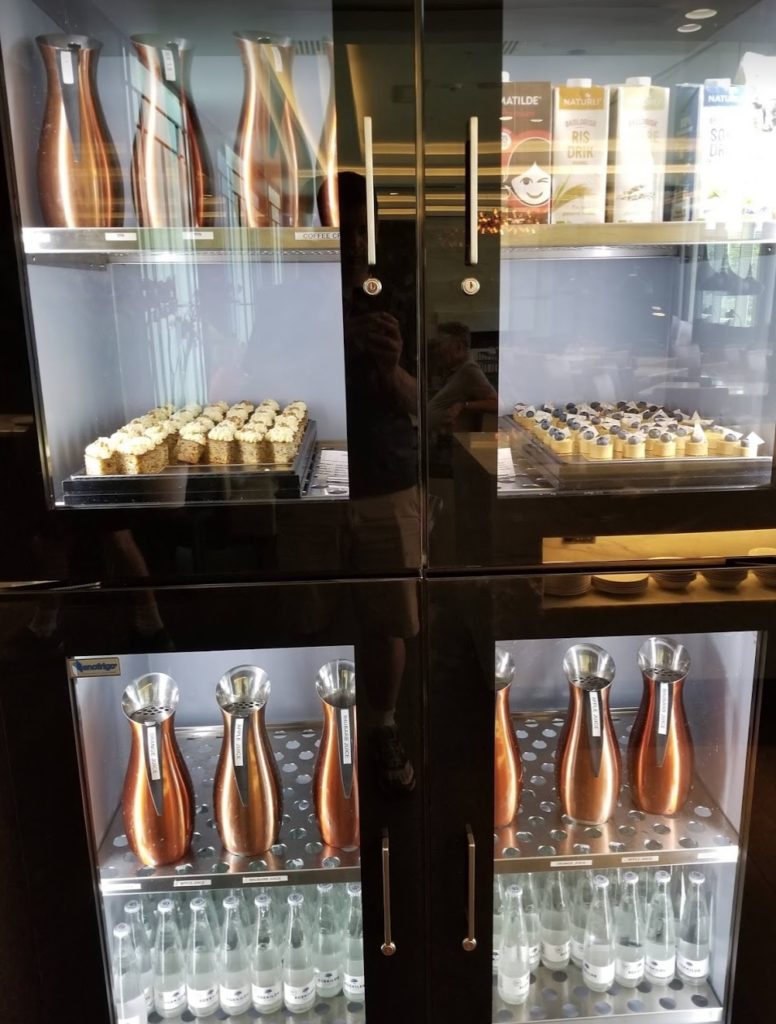 a glass cabinet with food in it