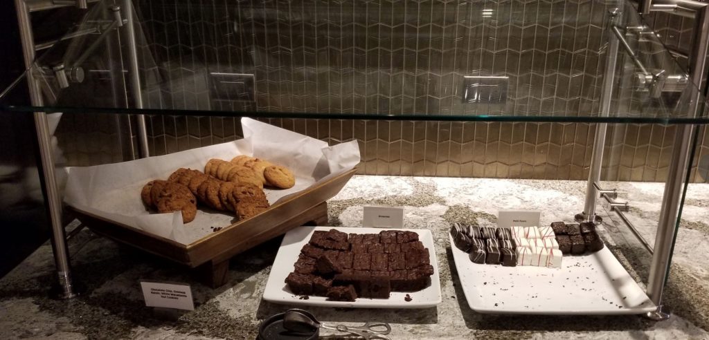 a tray of cookies and chocolates on plates