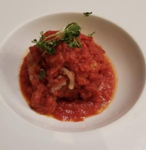 a plate of food on a white surface