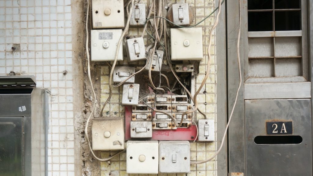 a group of switches and switches on a wall