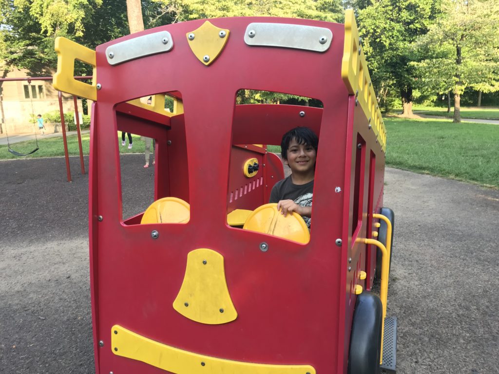 a boy in a toy car