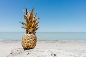 a pineapple on a beach
