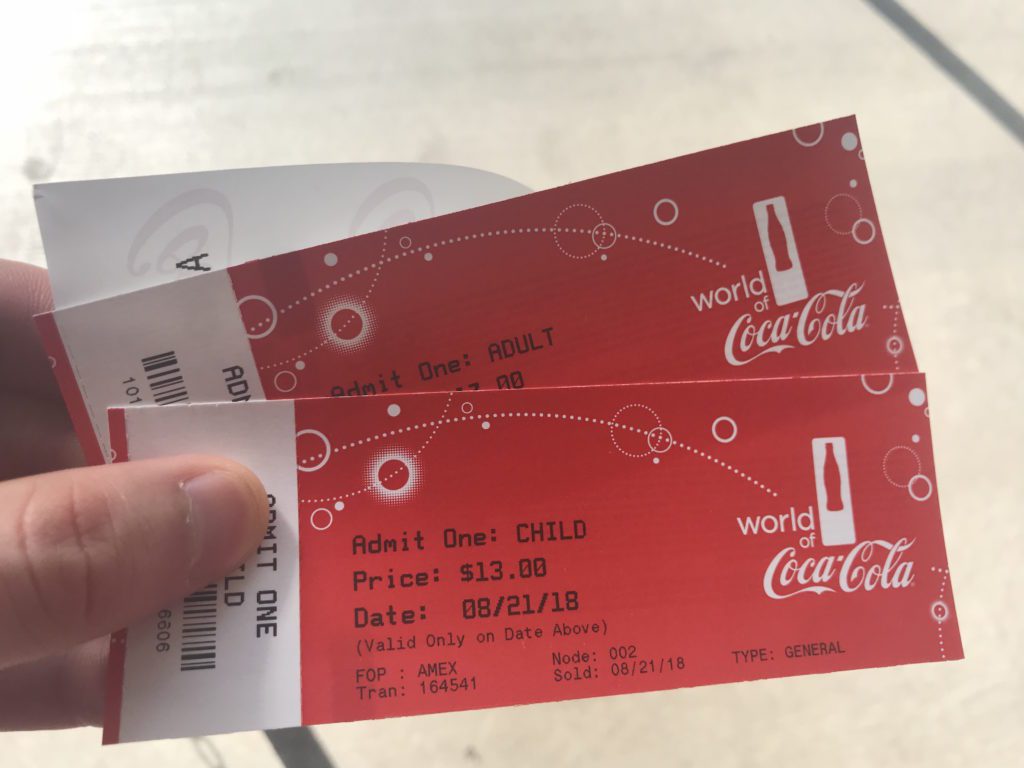 a pair of tickets in a hand