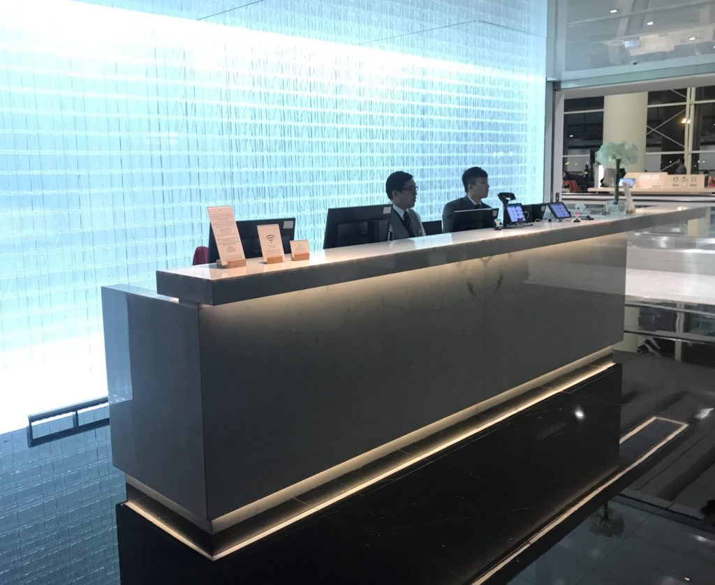 a group of people sitting at a reception desk
