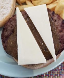 a cheeseburger with fries on a plate