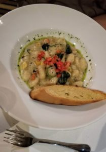 a plate of food with a slice of bread