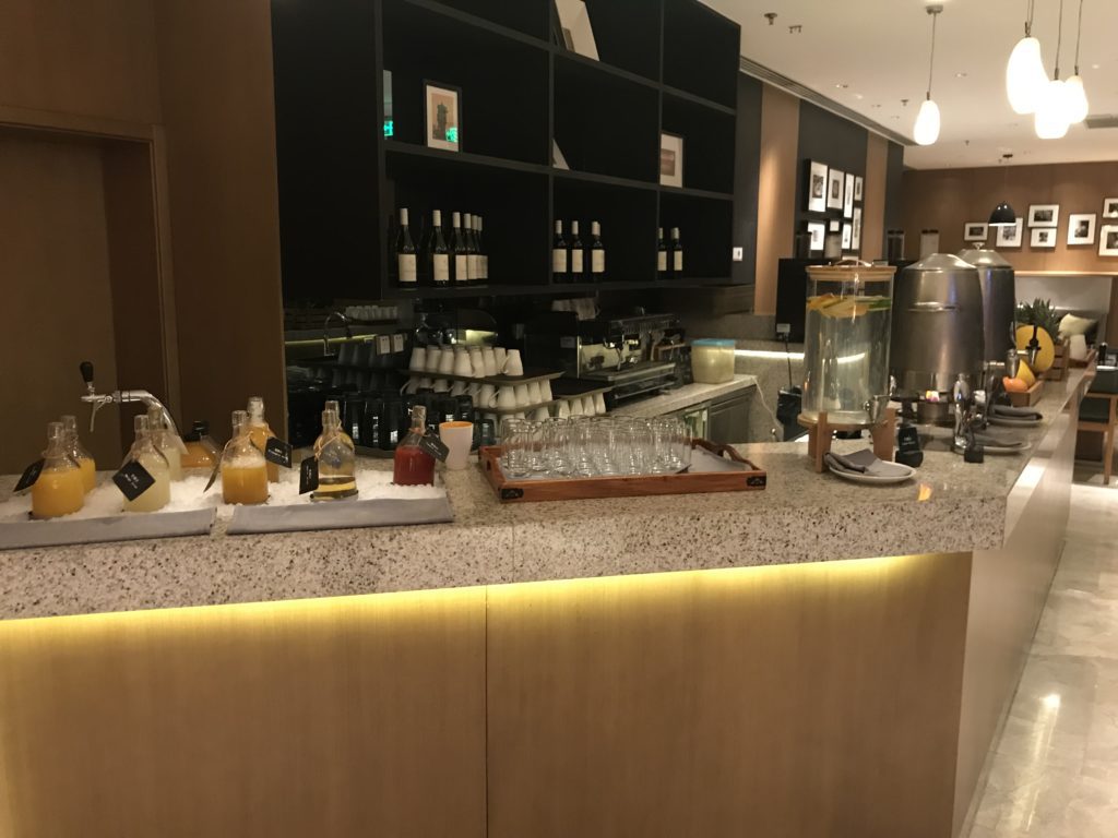 a bar with bottles and glasses on it