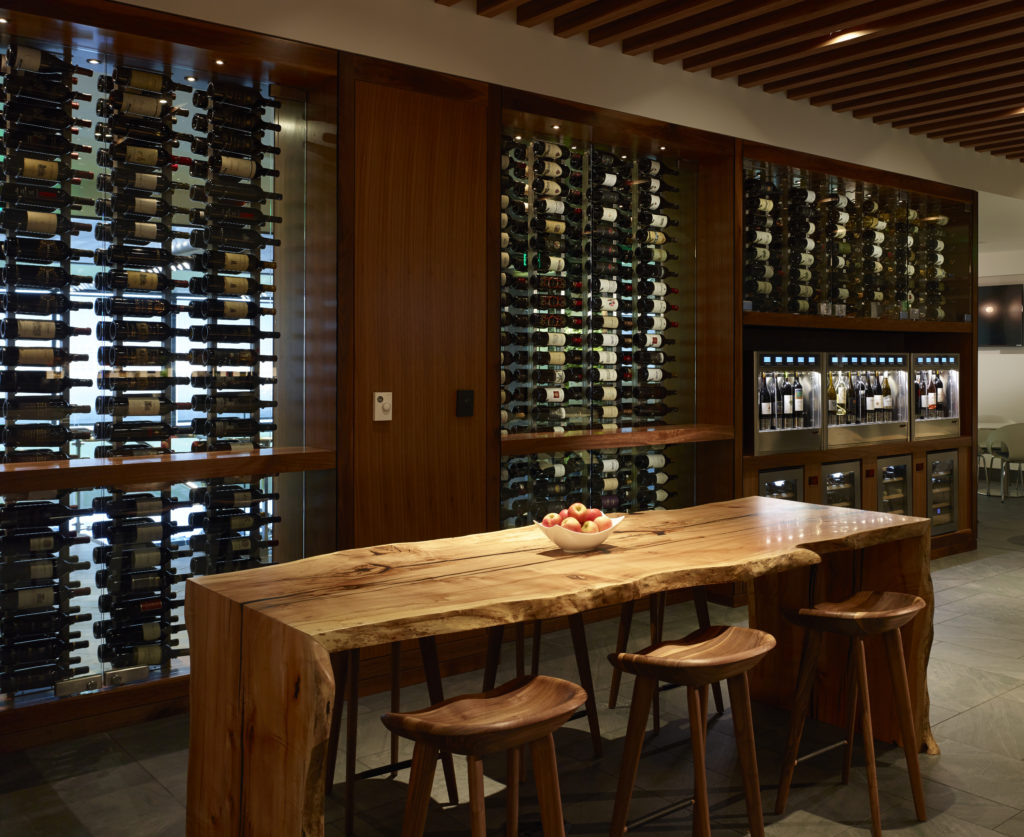 a wine cellar with a table and stools