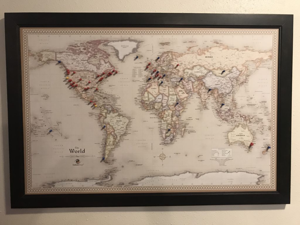 a map of the world with pins on it