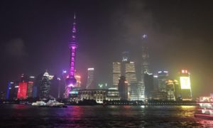a city skyline with purple lights