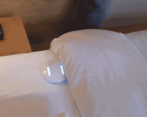 a computer mouse on a bed