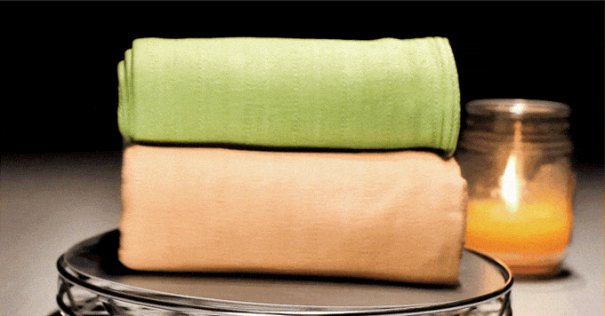 a close-up of a stack of folded blankets