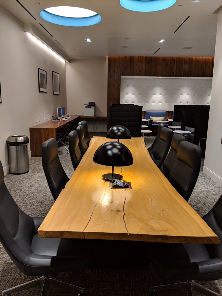 a table with chairs in a room