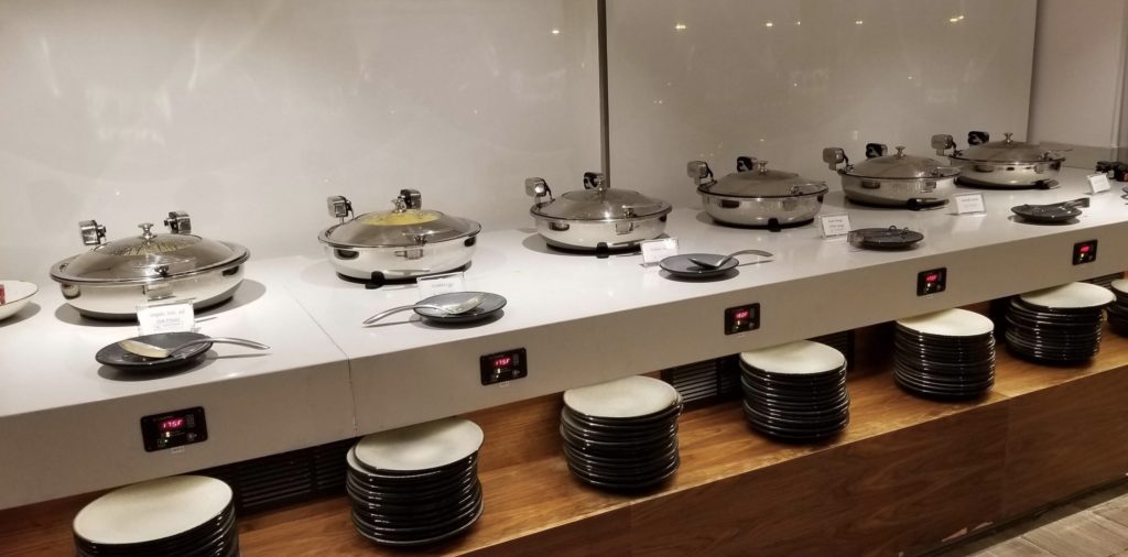 a row of pans on a counter