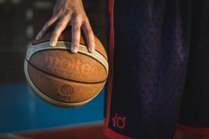 a person holding a basketball