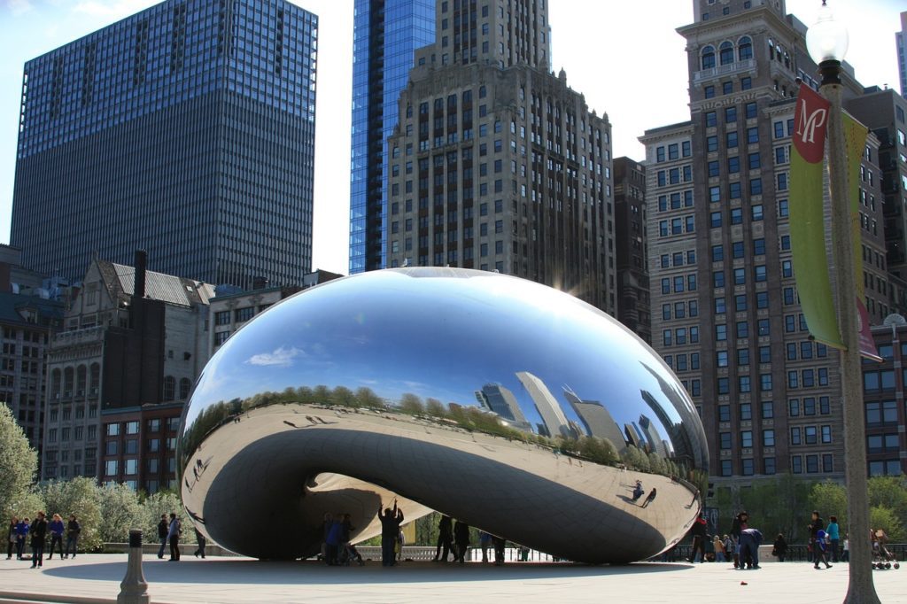 a large reflective object in Millennium Park