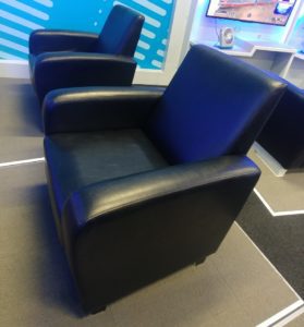 a pair of black leather chairs