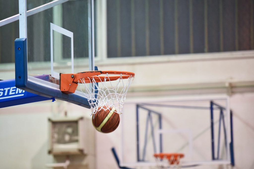 a basketball going through a net