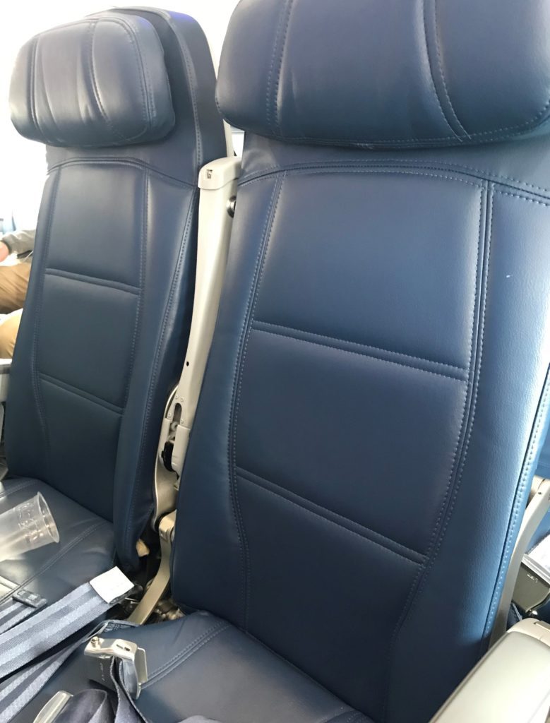 a blue seats on an airplane