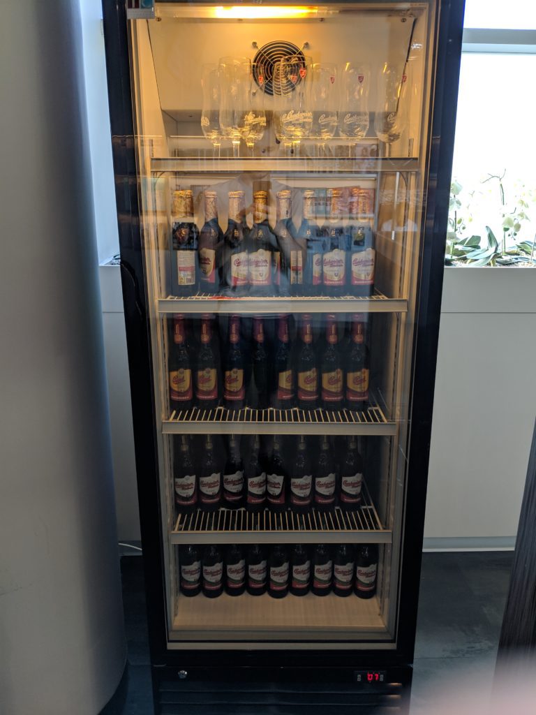a refrigerator with bottles of beer