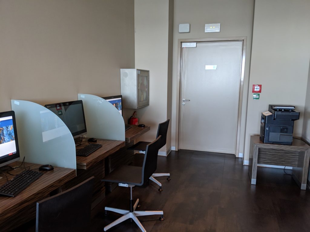 a room with computers and a door