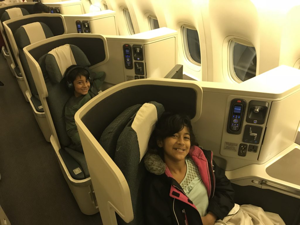 two children sitting in an airplane