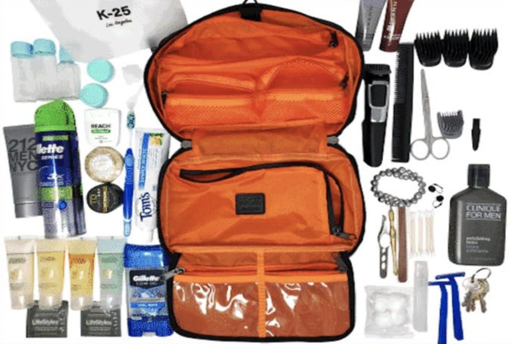 an orange toiletry bag with a variety of items on it
