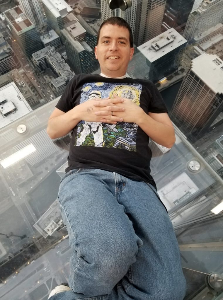 a man sitting on a glass floor