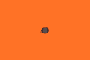 a black object on an orange background