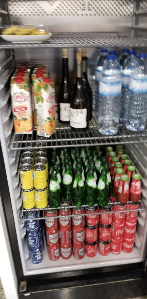a refrigerator full of drinks and beverages